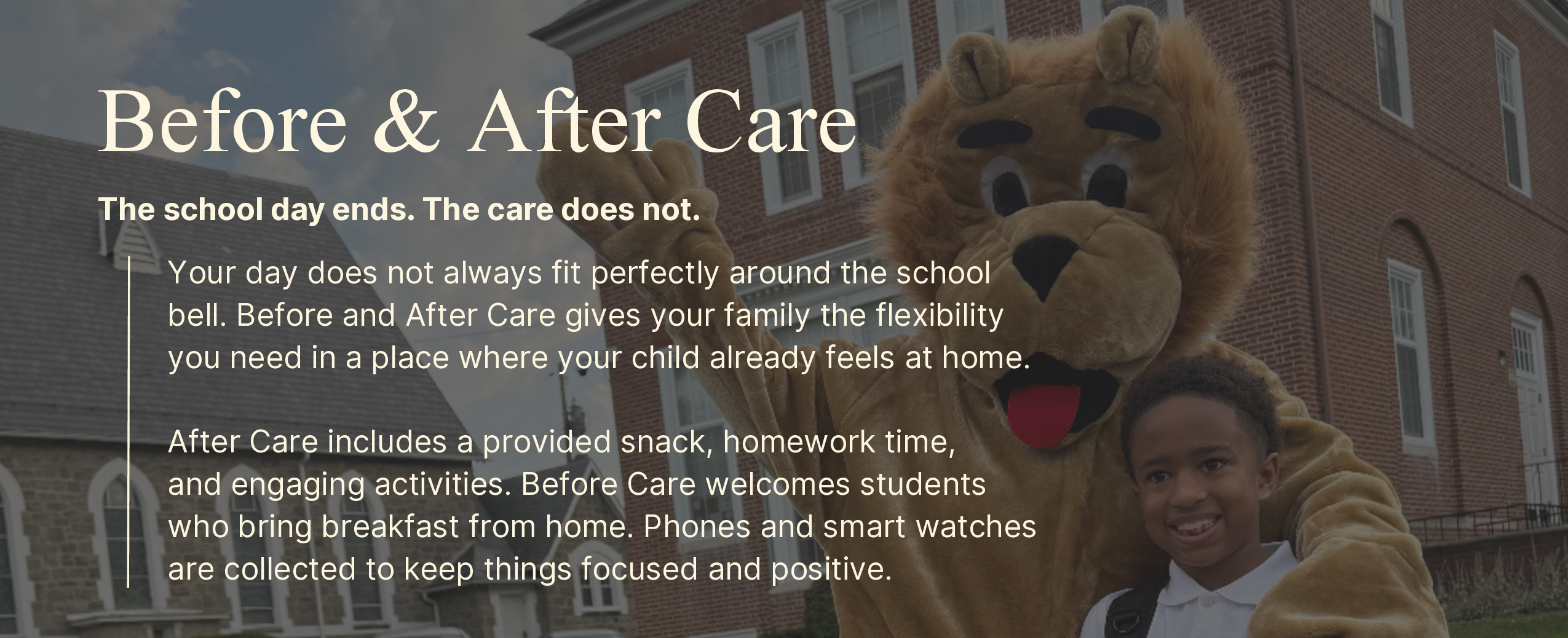 St Mark Student is embraced by Paws, the lion mascot in front of St Mark Catholic School in Catonsville, Maryland