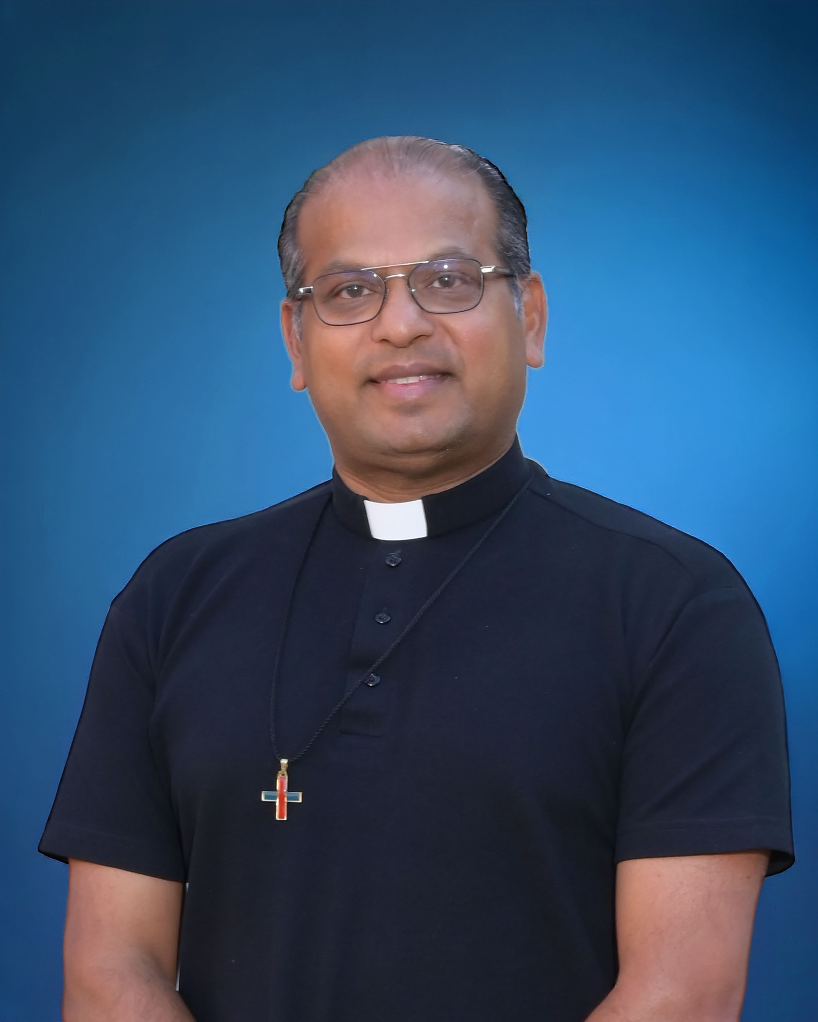 Portrait of St Mark School in Catonsville, Maryland, Pastor, Father Santhosh